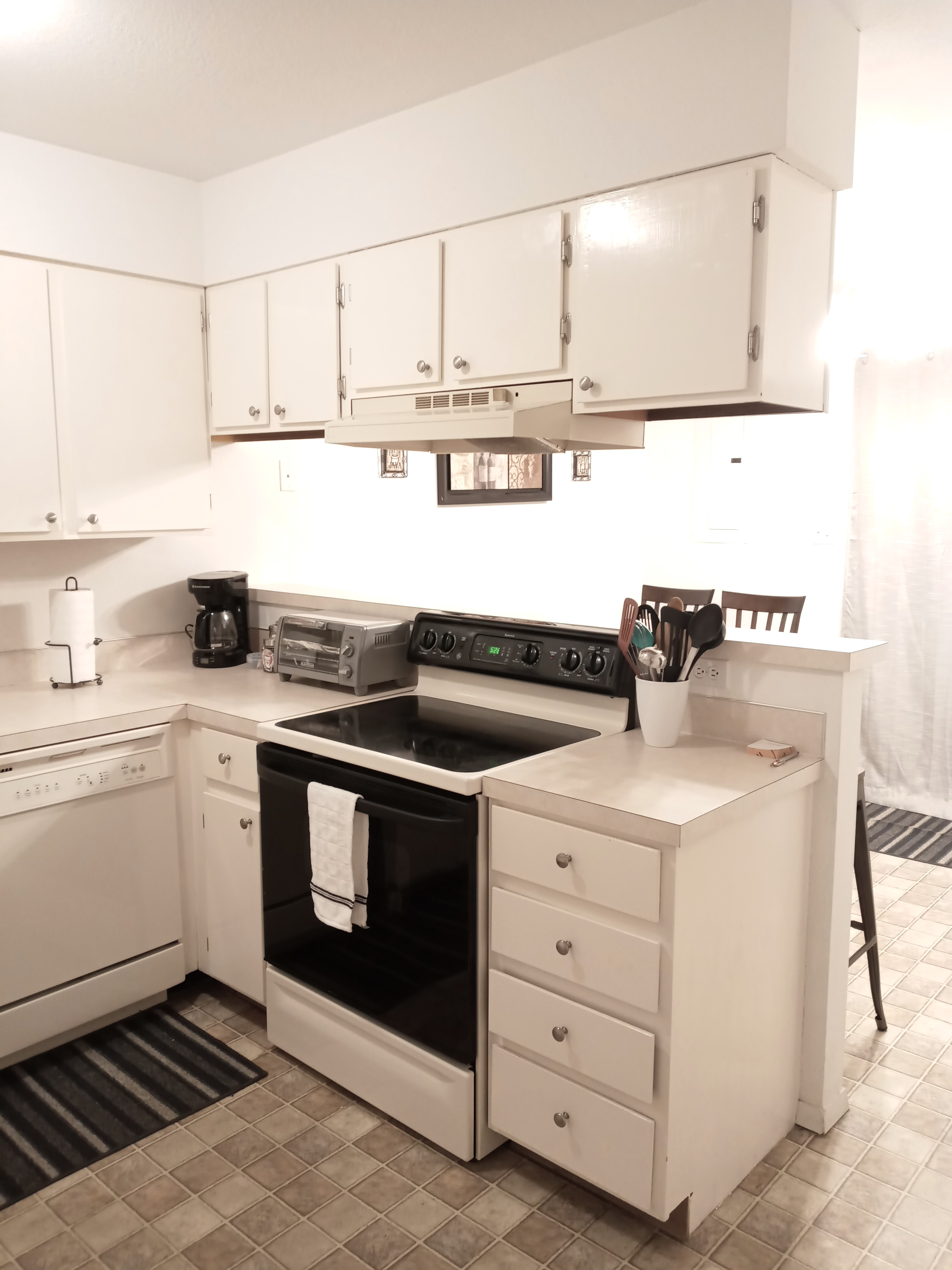Modern kitchen in white with essential appliances