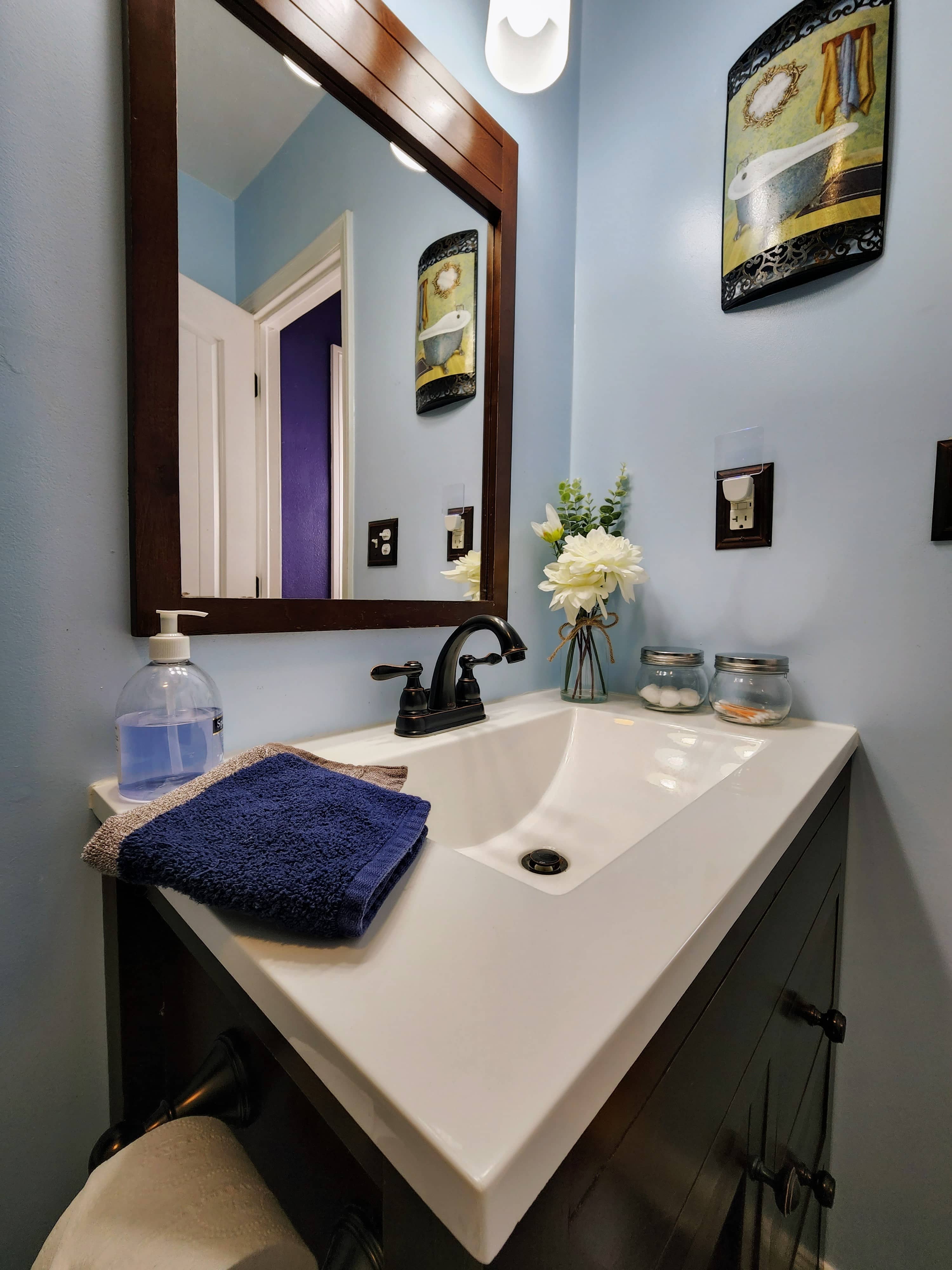 Sink photo with mirror, clean and well-lit