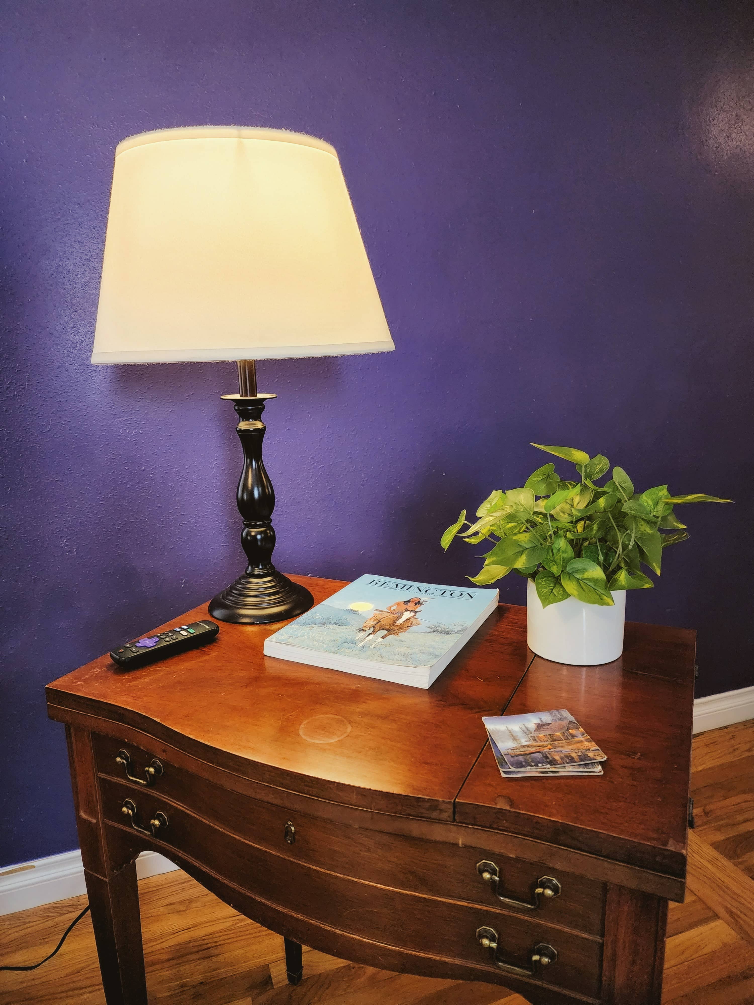 Side table with convenient plugs and a decorative lamp