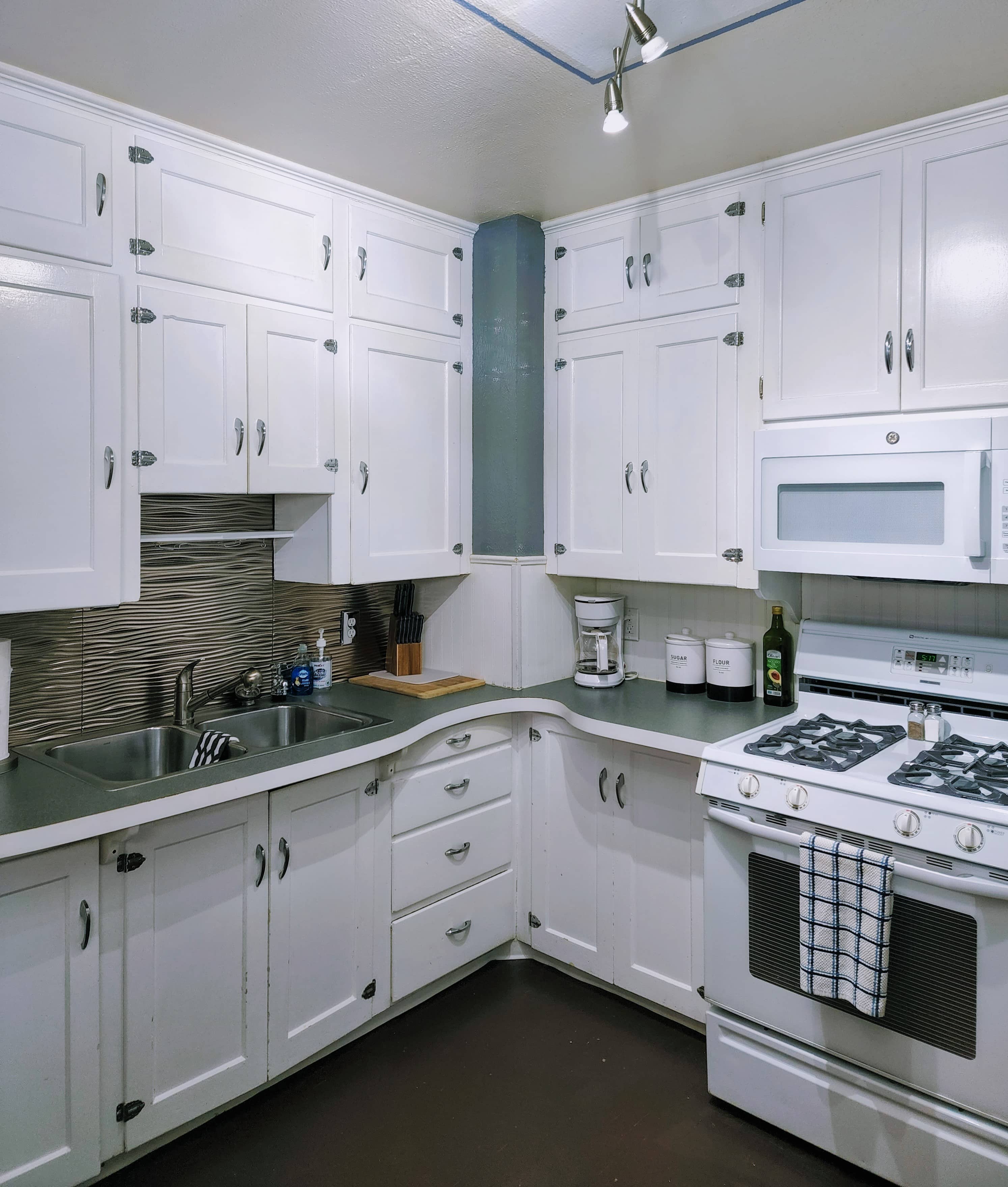 Kitchen with white and green appliances
