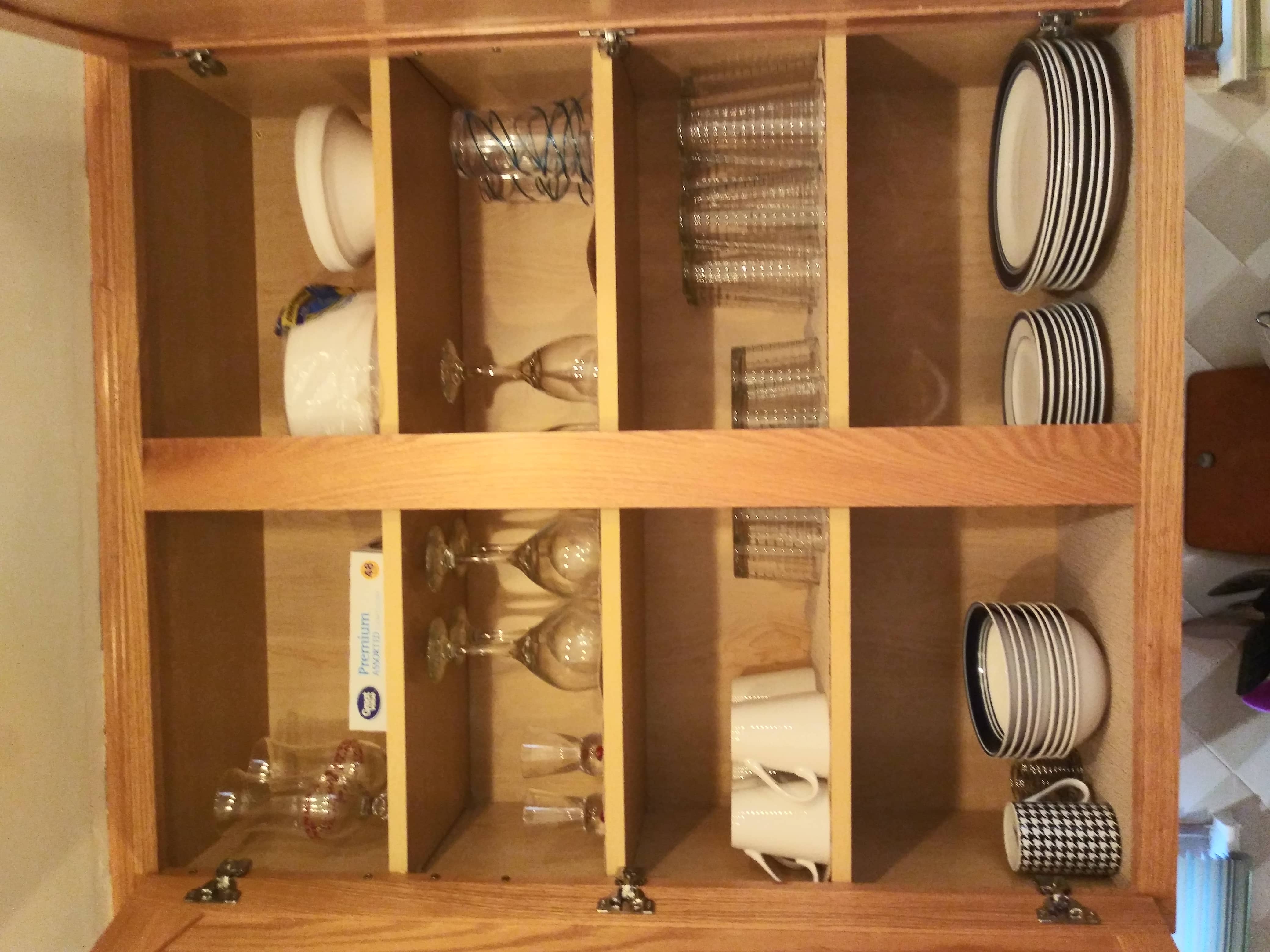 Fully stocked kitchen with dishware, glasses, mugs, plates, and silverware for 8