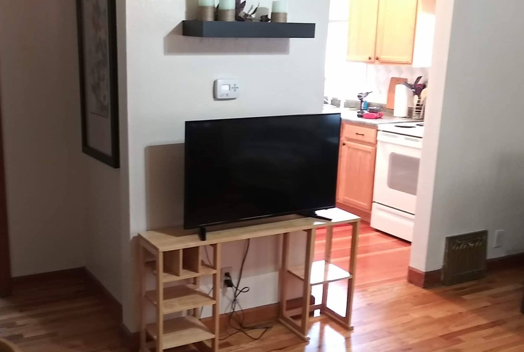 Television with a view into the kitchen area