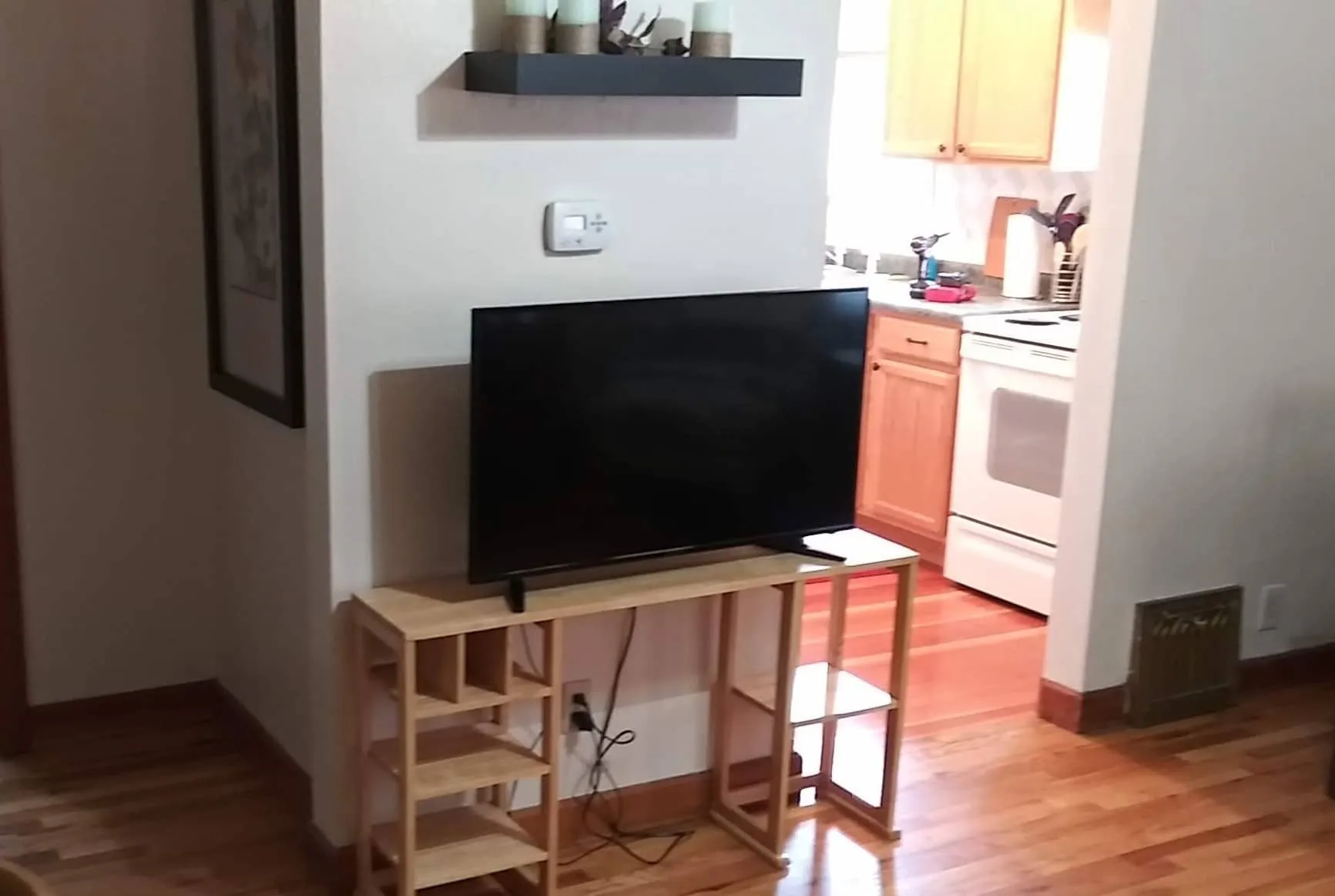 Television with a view into the kitchen area