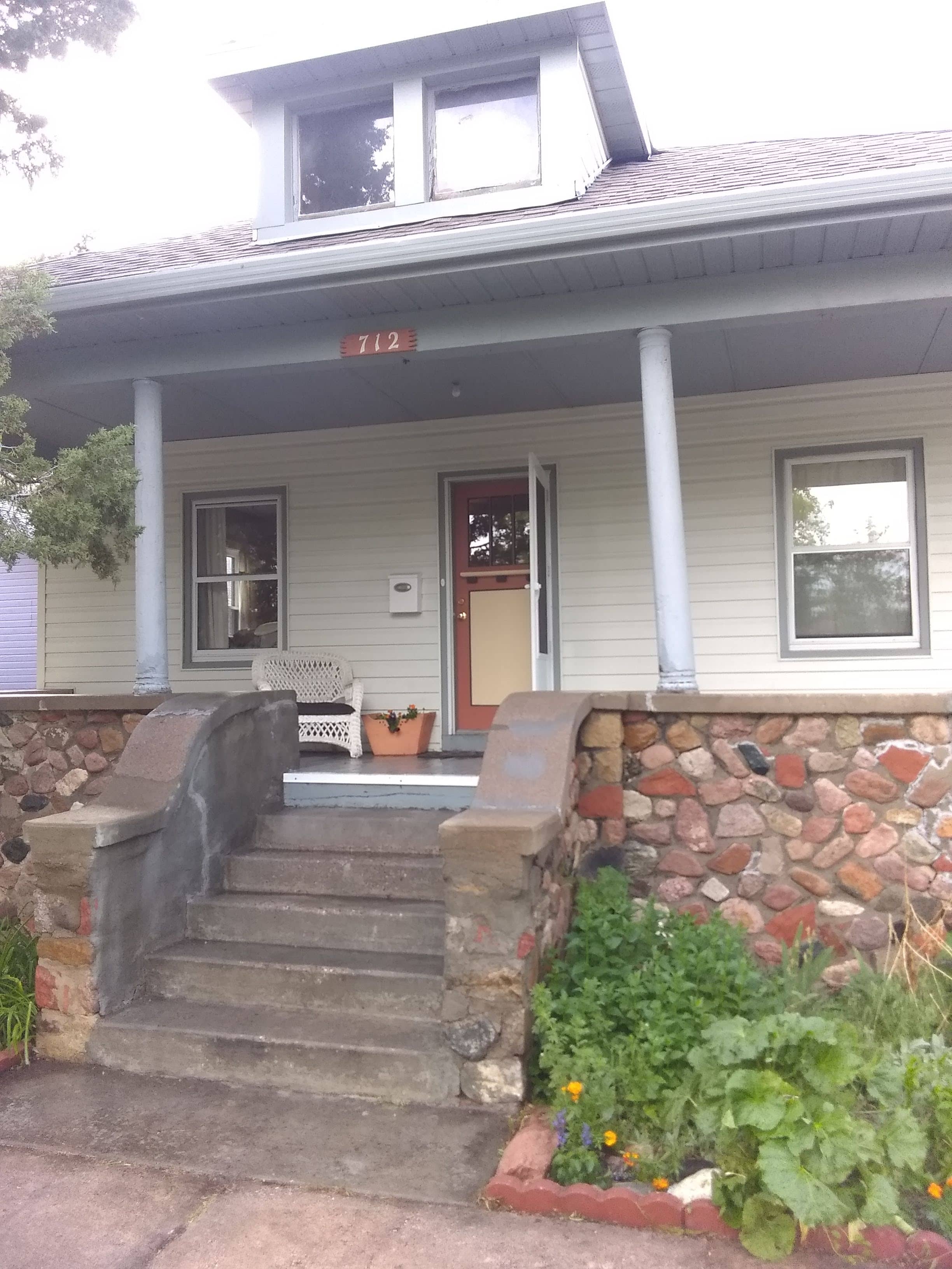 Stone porch house front view, nicely presented from another angle