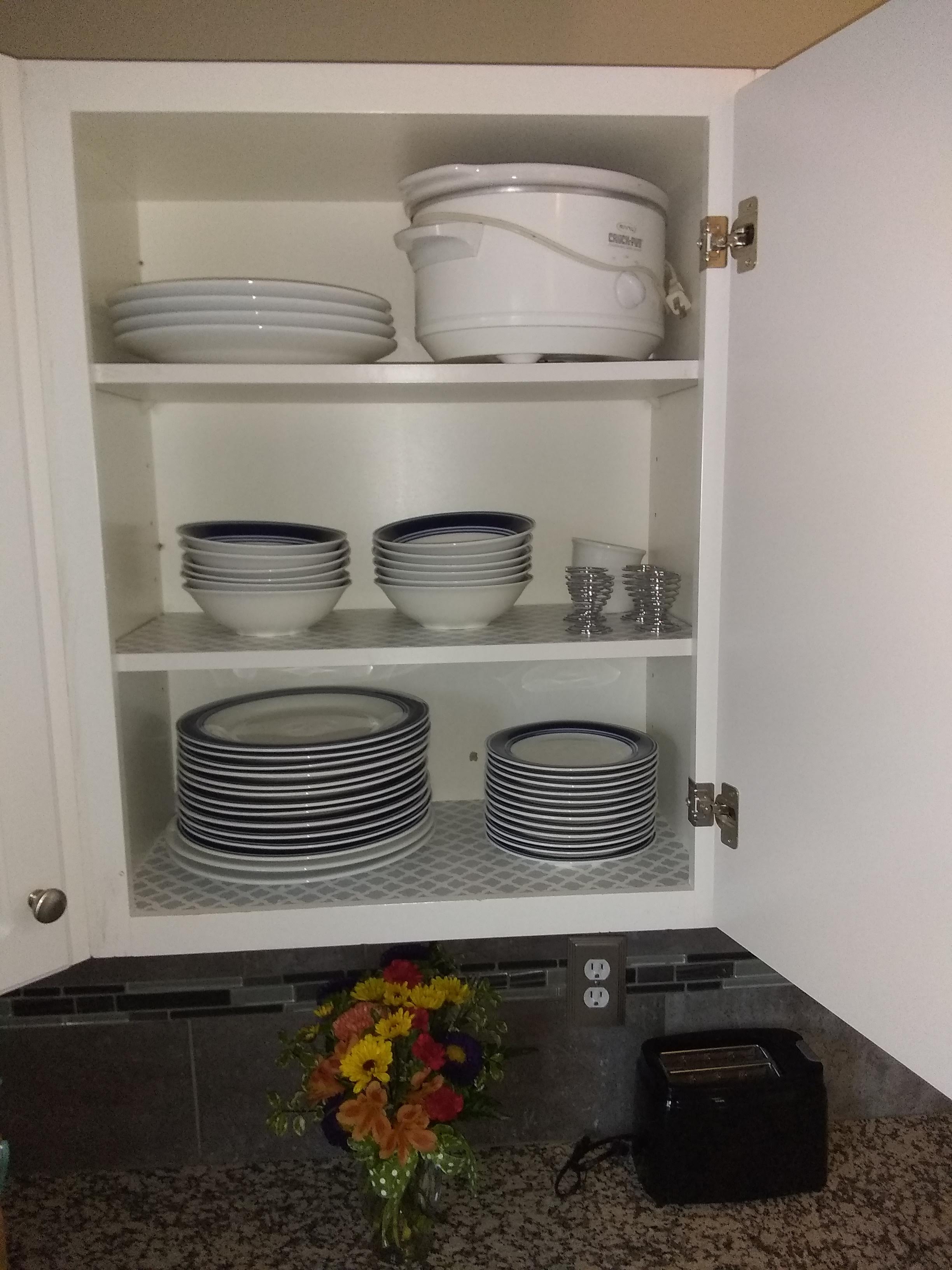 Plates, bowls, and silverware for 8, includes slow cooker